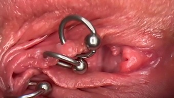 Intense Close-Up Of A Pierced Clit And Wet Pussy With Piss Play
